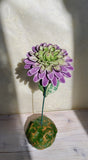 Fiore 3d con riflessi dorati.